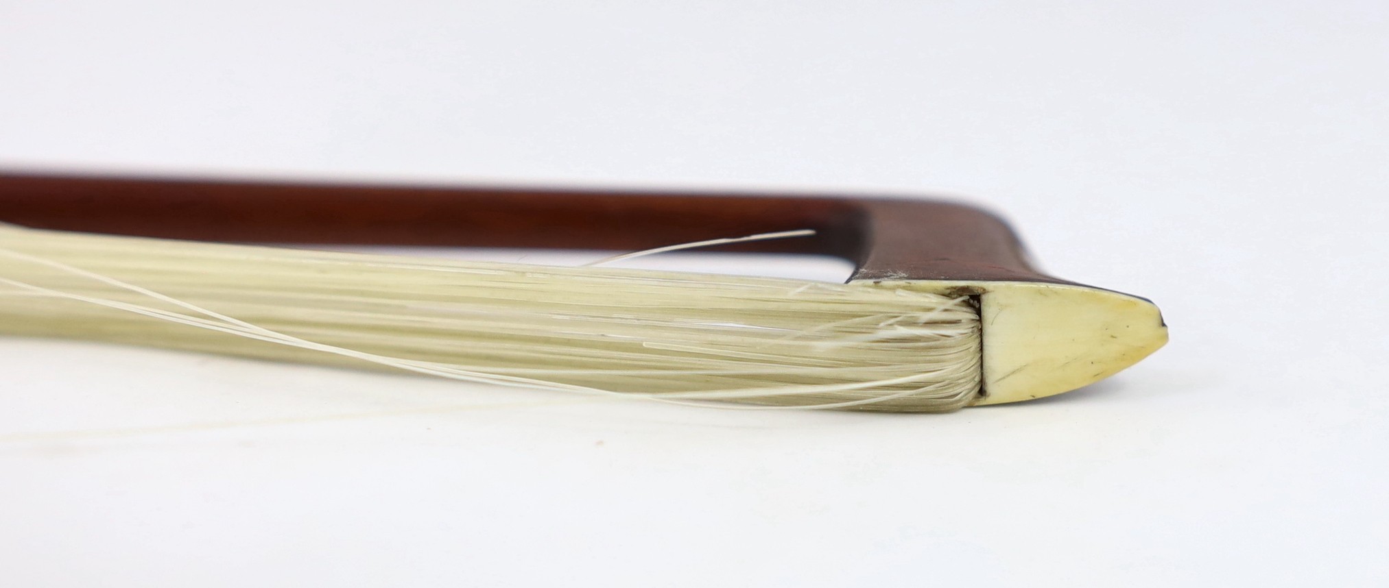 A silver mounted violin bow, stamped DODD, another stamped TOURTE and another bow